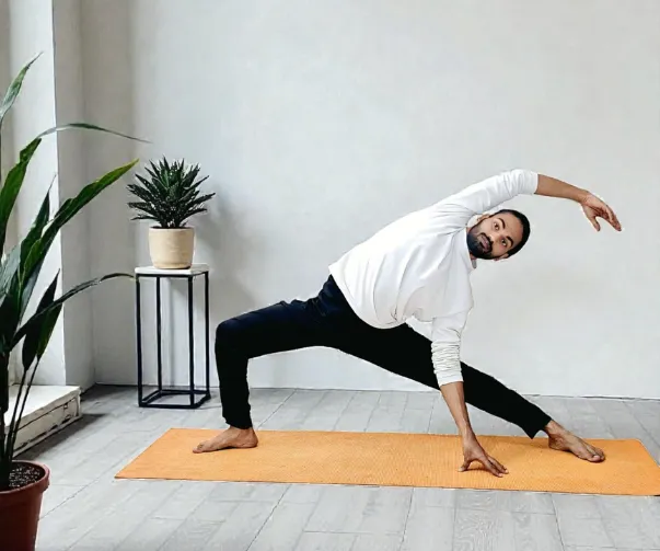 Woman practising yoga online UK